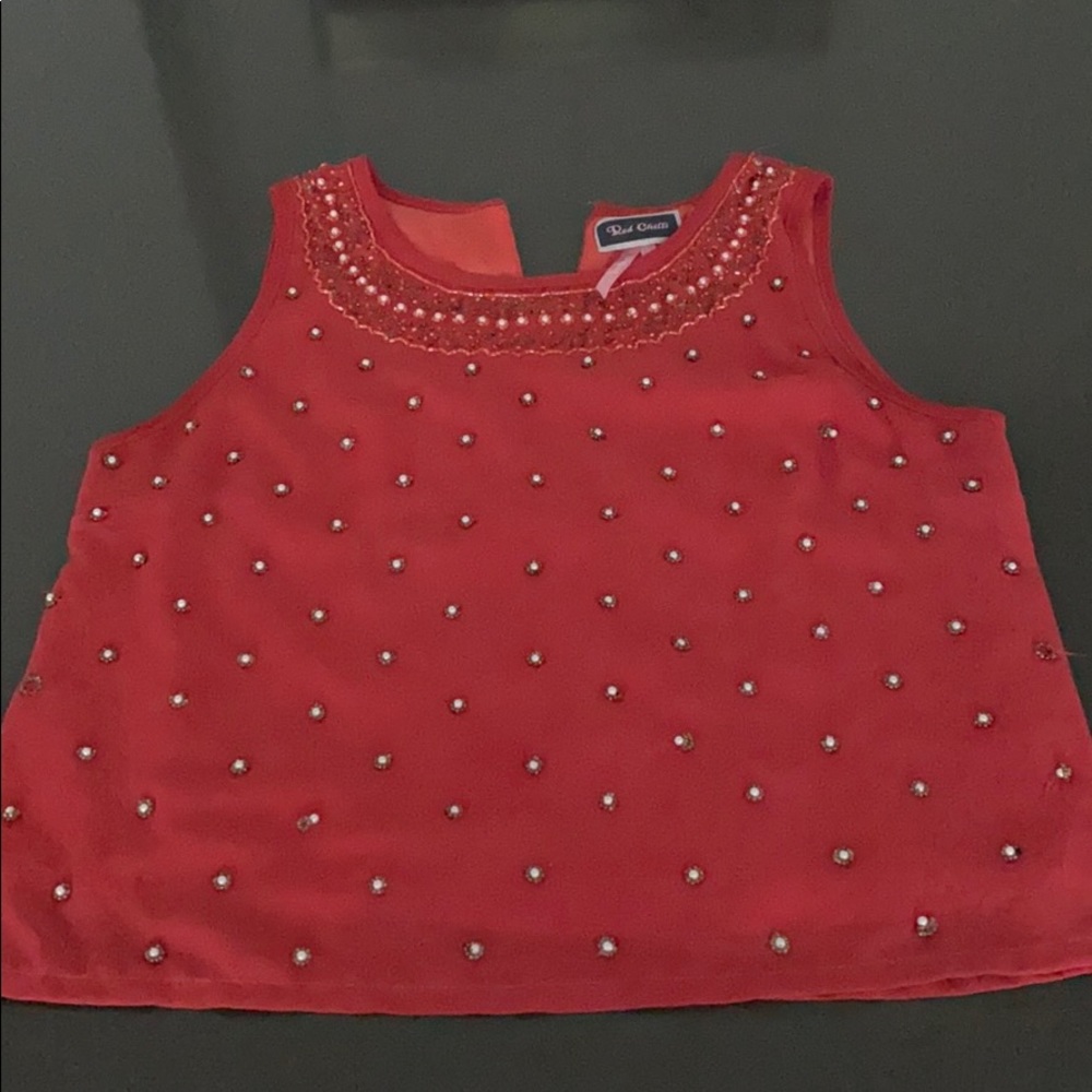 Sleeveless red sequin blouse